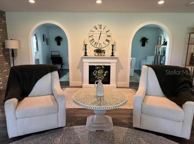 sitting room with hardwood / wood-style floors