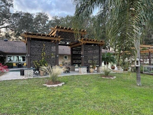 view of yard featuring a pergola and a patio