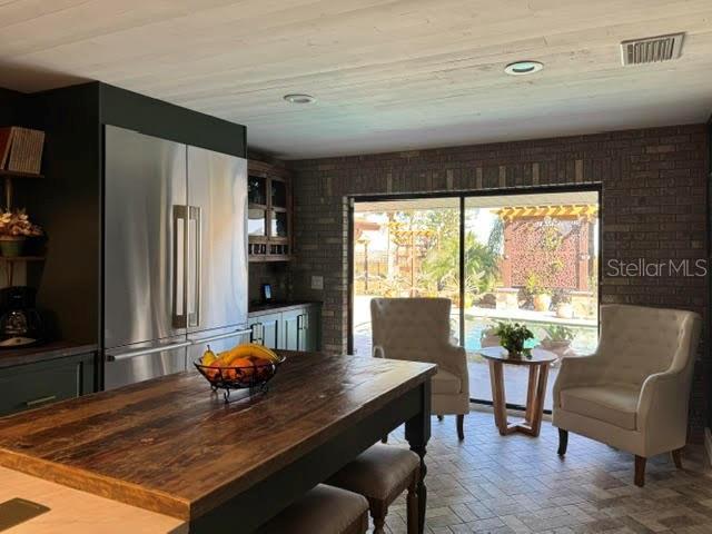 dining space with brick wall