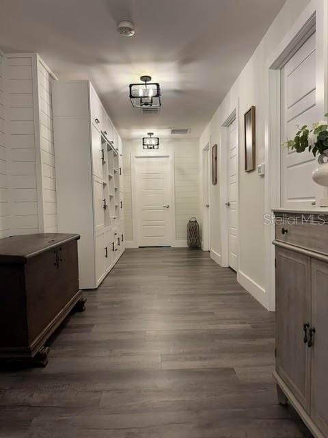 hallway with dark wood-type flooring