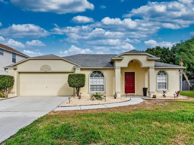 view of front facade featuring a garage and a front yard