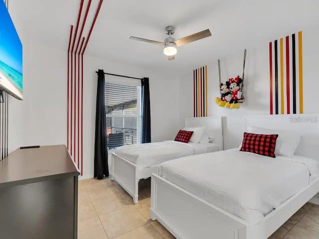 bedroom with light tile patterned floors and ceiling fan