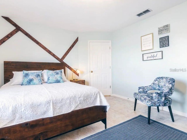 bedroom with tile patterned floors