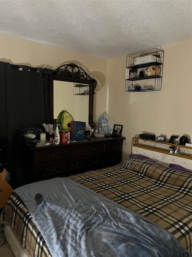 bedroom featuring a textured ceiling