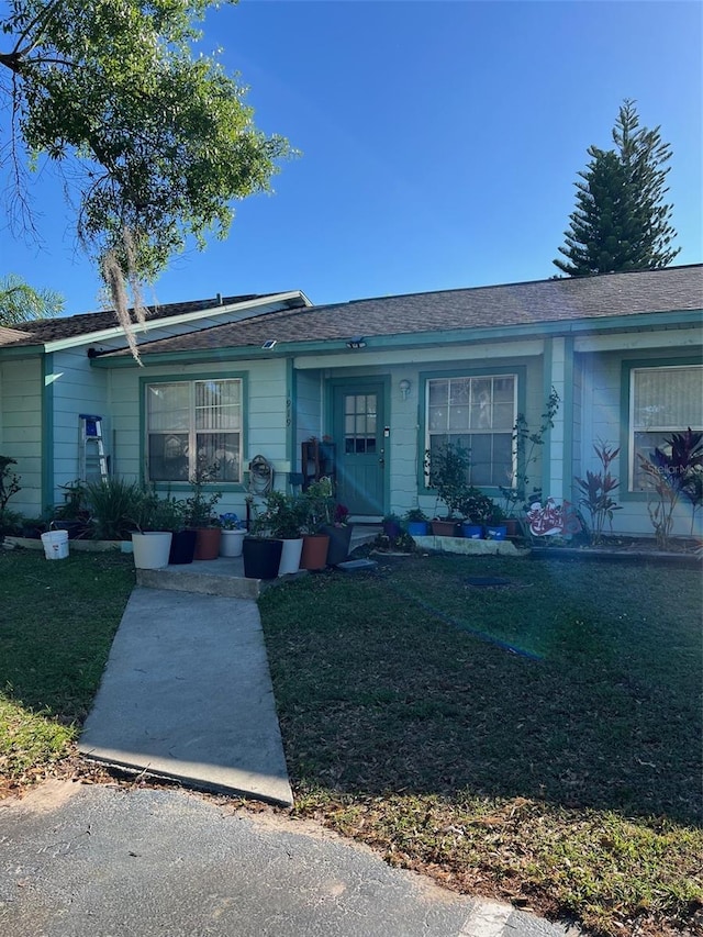 ranch-style house with a front lawn