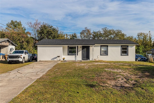 ranch-style house with a front lawn