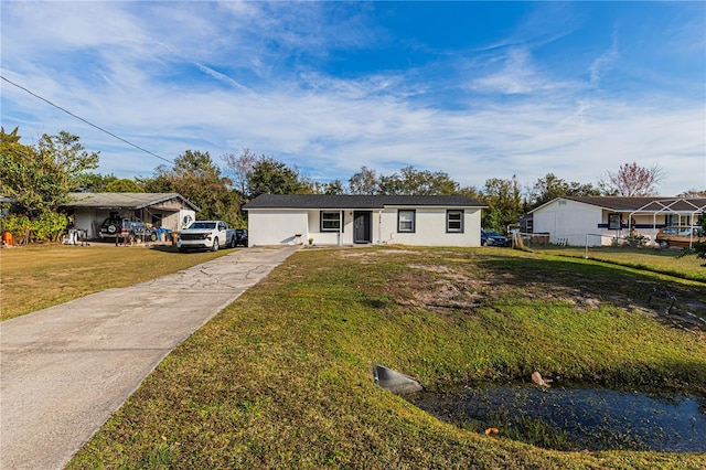 single story home featuring a front yard