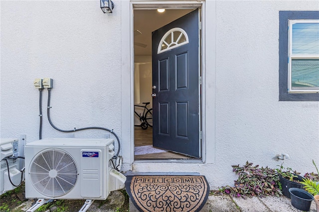 doorway to property with ac unit