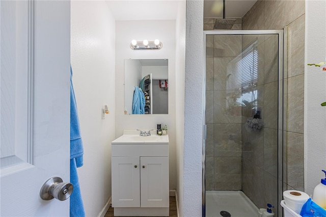 bathroom with vanity and an enclosed shower