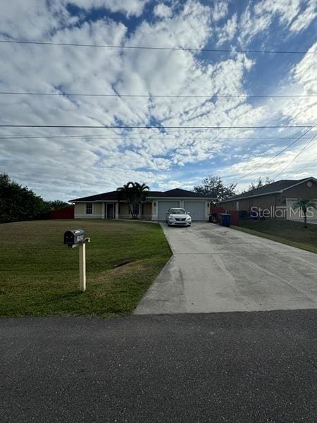 single story home with a garage and a front lawn