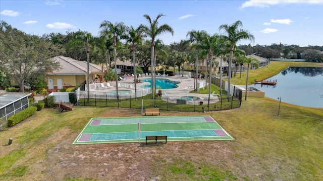 view of community with a water view and a lawn