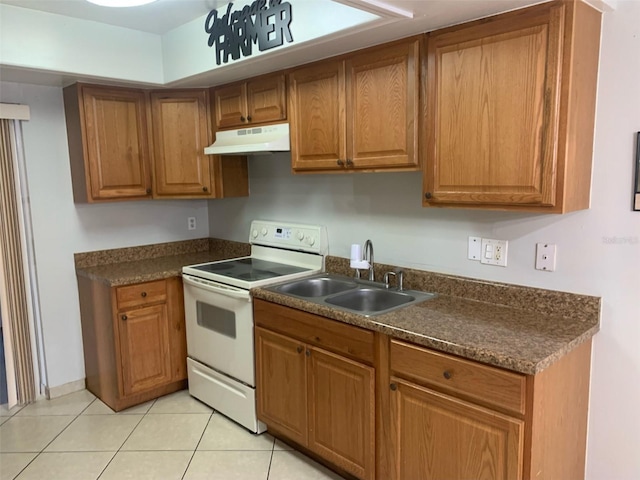 kitchen featuring sink, light tile patterned flooring, and white range with electric cooktop