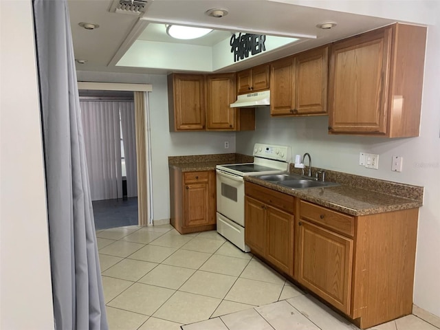 kitchen with light tile patterned flooring, sink, and white electric range