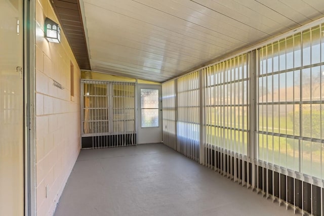 unfurnished sunroom with vaulted ceiling