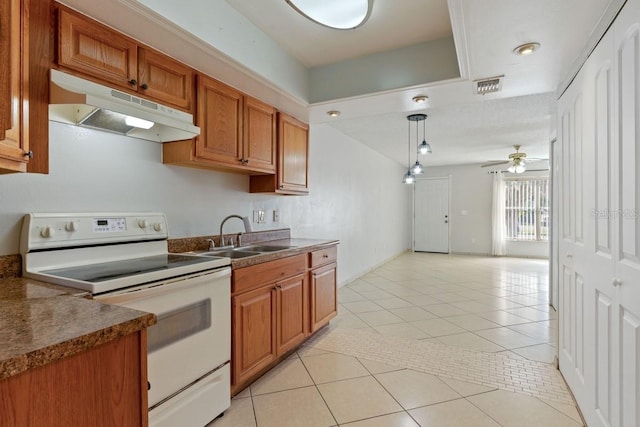 kitchen with under cabinet range hood, a sink, dark countertops, white electric stove, and light tile patterned flooring