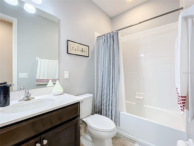 full bathroom with shower / bathtub combination with curtain, vanity, and toilet