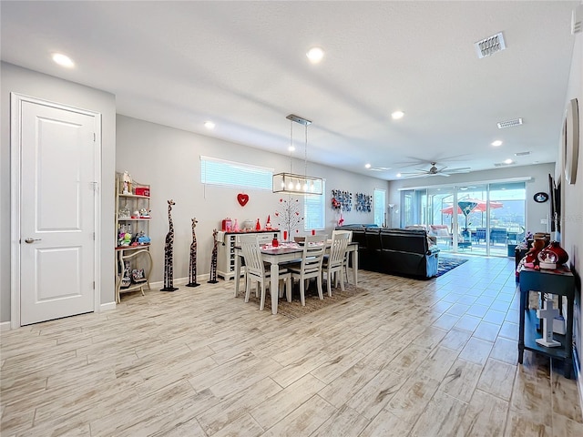 dining area featuring ceiling fan and light hardwood / wood-style flooring