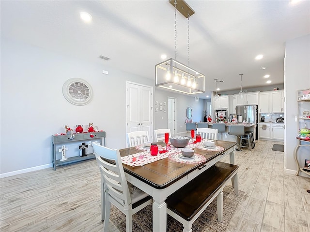 dining space featuring light hardwood / wood-style floors