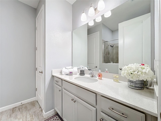 bathroom featuring vanity and tiled shower