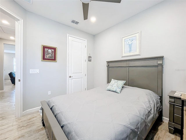 bedroom with ceiling fan and light wood-type flooring