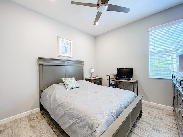 bedroom featuring ceiling fan and light hardwood / wood-style flooring