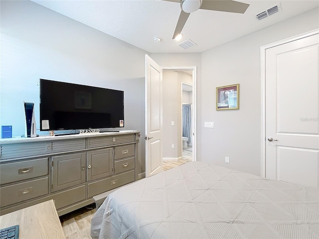 bedroom with ceiling fan and light hardwood / wood-style floors