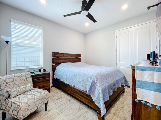 bedroom with ceiling fan and light wood-type flooring