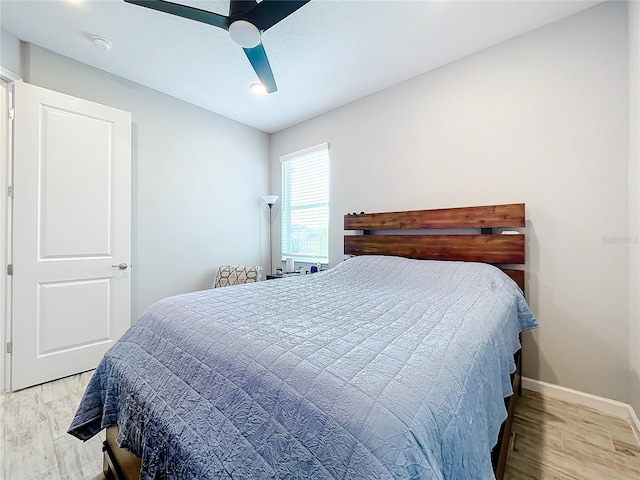 bedroom featuring ceiling fan and light hardwood / wood-style floors