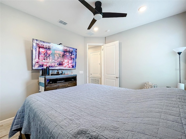 bedroom with ceiling fan and light wood-type flooring