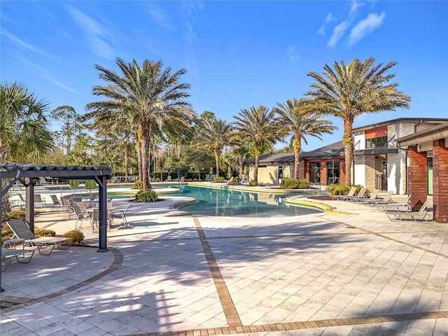 view of swimming pool featuring a patio area and a pergola