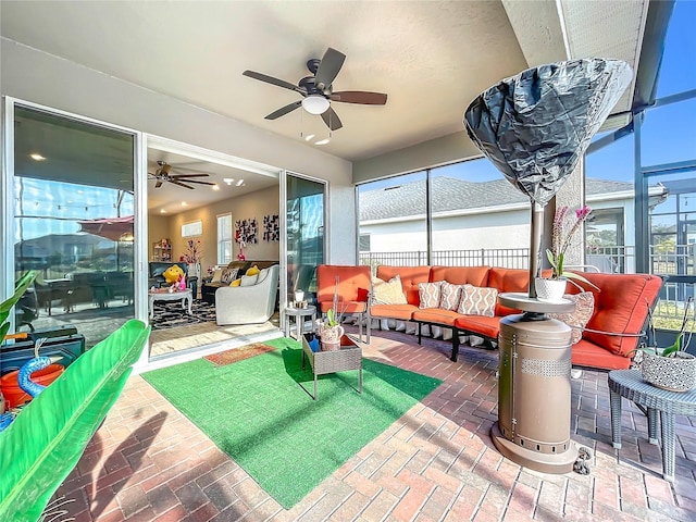 sunroom / solarium with ceiling fan