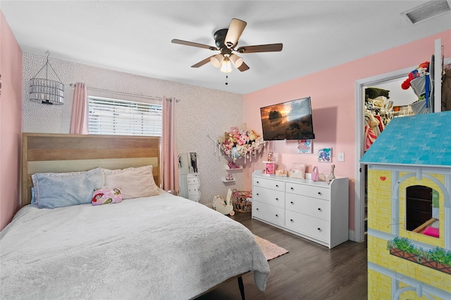 bedroom featuring dark hardwood / wood-style floors and ceiling fan