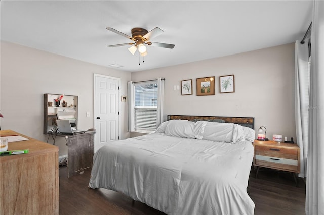 bedroom with dark wood-type flooring and ceiling fan