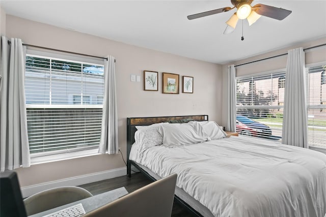 bedroom featuring dark wood-type flooring and ceiling fan