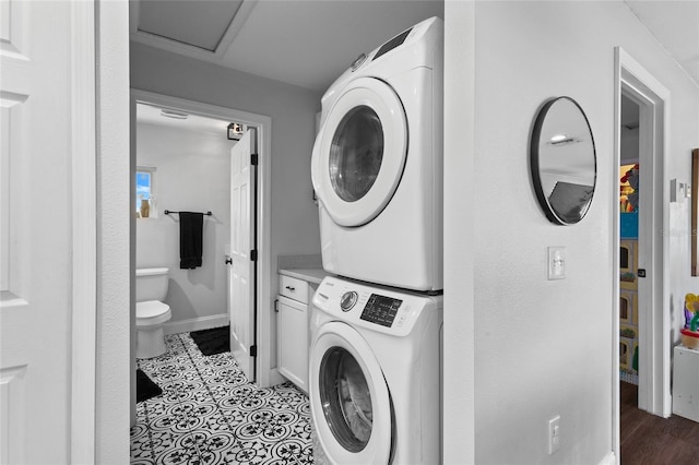 laundry room featuring stacked washer / dryer