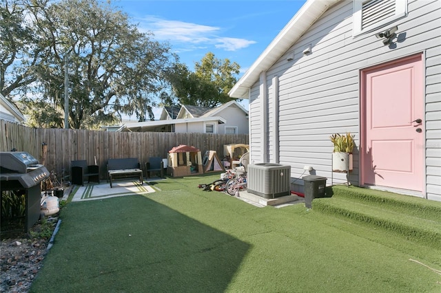 view of yard featuring a patio and central air condition unit