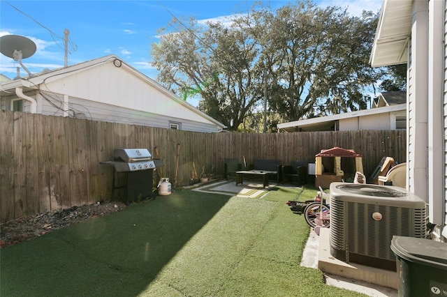 view of yard with a patio and central AC unit