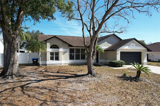 ranch-style home with a garage