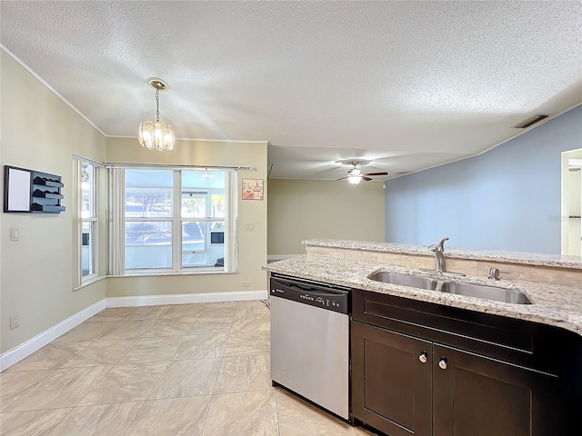 kitchen featuring stainless steel dishwasher, decorative light fixtures, light stone countertops, and sink