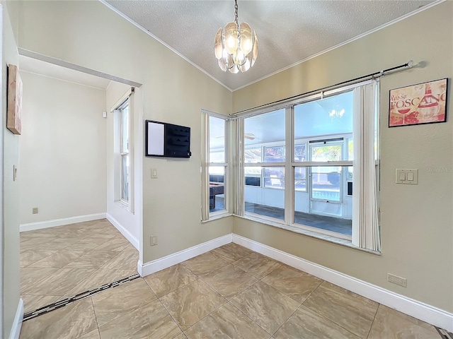 spare room with ornamental molding, a chandelier, vaulted ceiling, and a textured ceiling