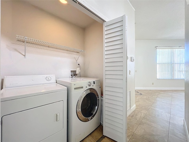 laundry room with separate washer and dryer