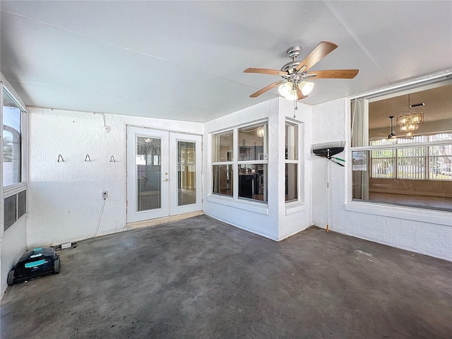 unfurnished sunroom featuring french doors and ceiling fan