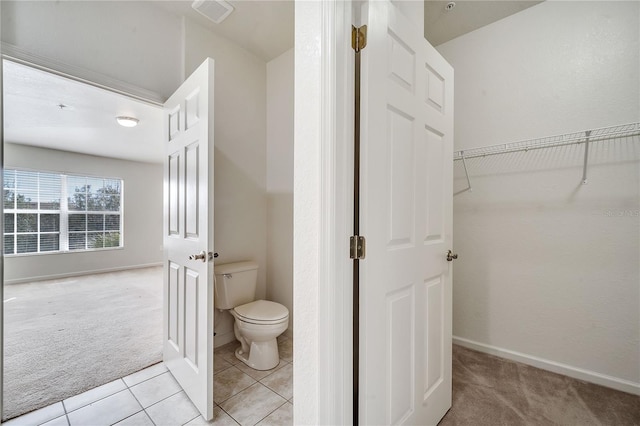 bathroom with tile patterned floors and toilet