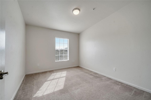 empty room with light colored carpet