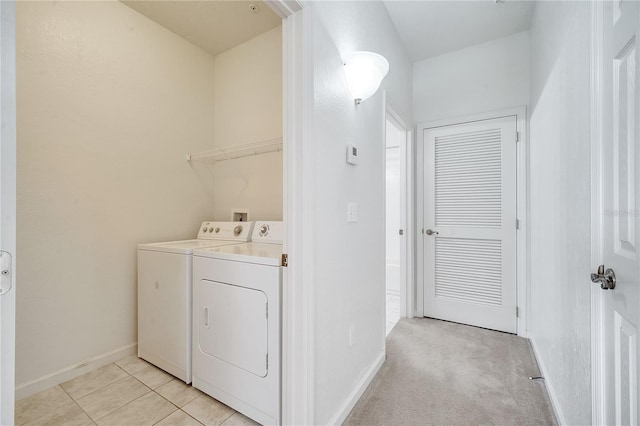 washroom with independent washer and dryer and light colored carpet