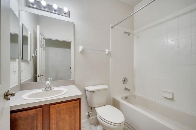 full bathroom with vanity, toilet, and tiled shower / bath combo