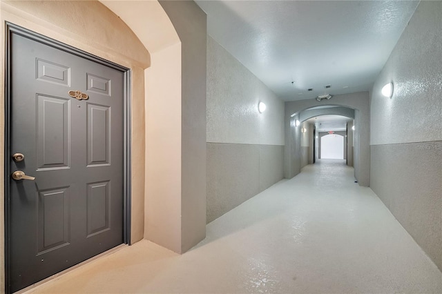 hallway featuring concrete floors