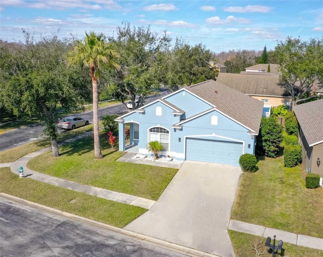 view of front of house featuring a garage and a front yard