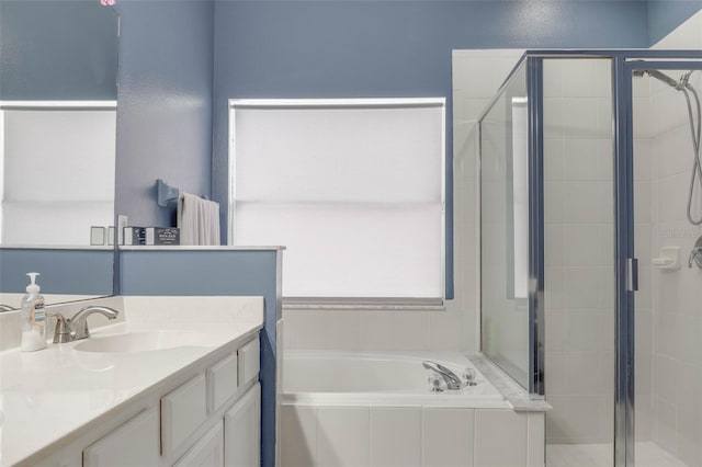 bathroom featuring vanity and separate shower and tub