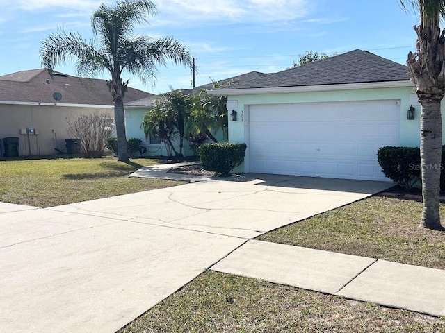 ranch-style home featuring cooling unit, a garage, and a front lawn